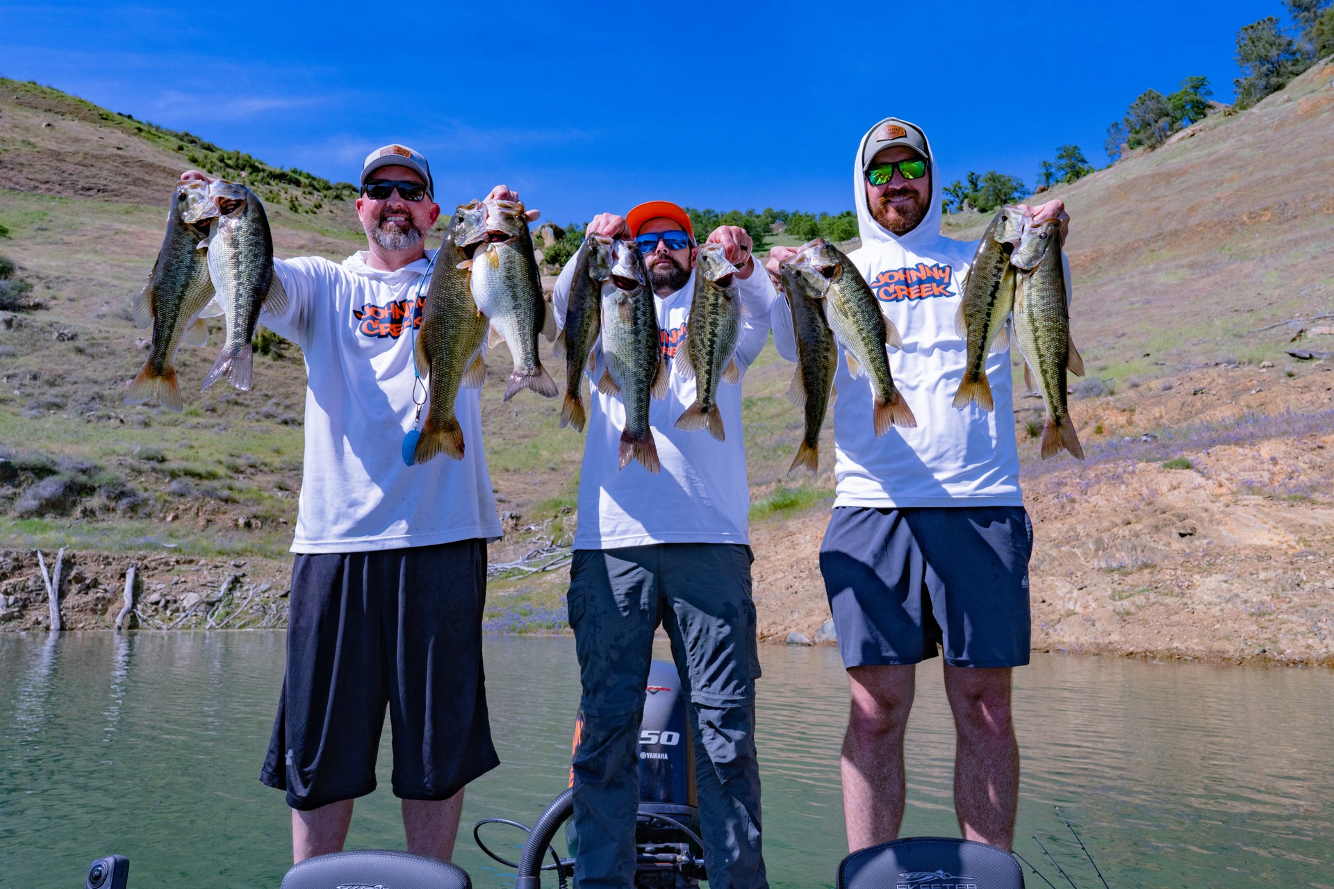 The three Johnny Creek Baits founders holding their catch